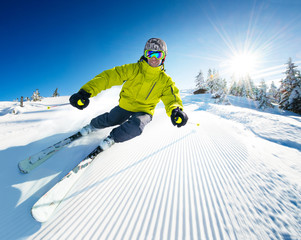 Skier on pise in high mountains