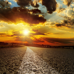 Wall Mural - asphalt road and dramatic sunset over it