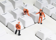 Tiny Figures Of Construction Engineers Removing End Key