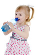 © Ermolaev Alexandr - baby girl drinks water from a bottle. isolated