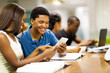 © michaeljung - happy african college students using tablet computer together