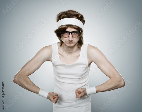 Fototapeta do kuchni Funny retro nerd flexing his muscle