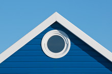 Round Window In Blue Beach Hut Gable