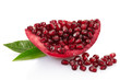 Pomegranate slice with leaves on white with clipping path