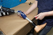 © belahoche - A technician adjusts a prosthetic foot.