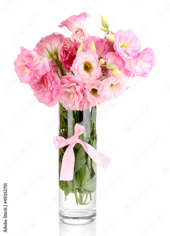 bouquet of eustoma flowers in vase, isolated on white