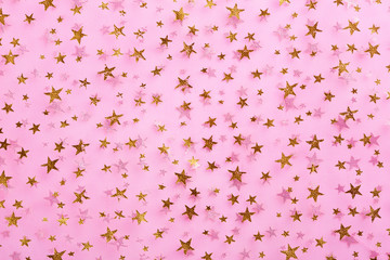 gold stars on pink textile