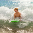 © travelview - boy has fun at the beach
