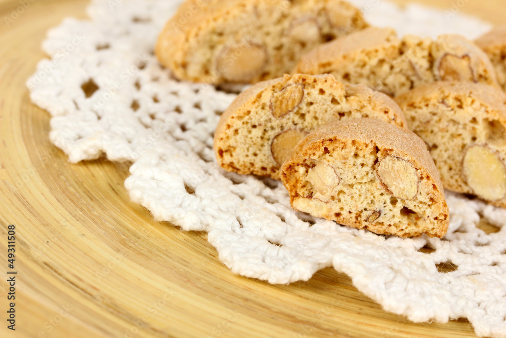 Aromatic cookies cantuccini on wooden plate close-up