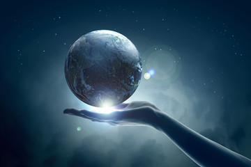 Wall Mural - image of earth planet on hand
