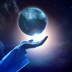 Wall Mural - image of earth planet on hand