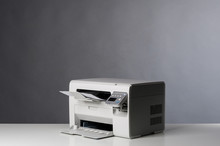 Laser Printer Isolated On Grey Background.
