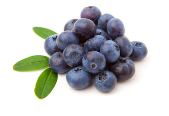 Wall Mural - Blueberries with green leaves isolated on white background