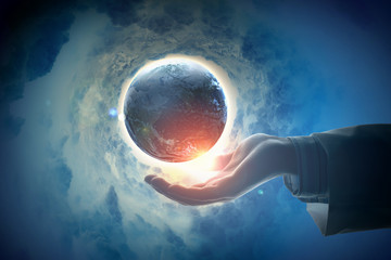 Wall Mural - Image of earth planet on hand