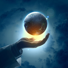 Wall Mural - Image of earth planet on hand