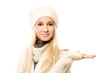 © lenets_tan - Attractive smiling woman in warm clothing holding