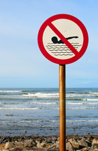 No Swimming Sign With Rough Sea