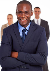 Wall Mural - handsome african american businessman in front of team