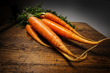 Wall Mural - carrots on an old wooden background