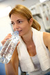 © goodluz - Portrait of fitness girl drinking water