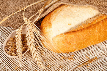 Fresh baked traditional bread and wheat