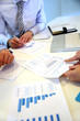 © goodluz - Closeup on business papers set on table