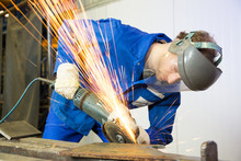 Construction Worker With Angle Grinder