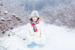 © famveldman - Happy smiling child playing in a snow field