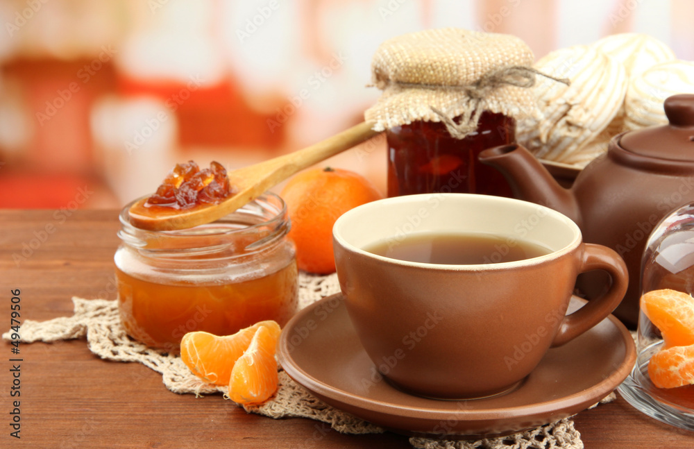 light breakfast with tea and homemade jam, on wooden table