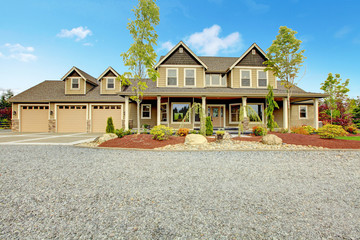 Large farm country house with gravel driveway