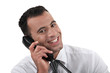 © auremar - Businessman using land-line telephone
