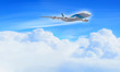 White passenger plane in the blue sky