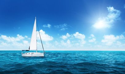 Wall Mural - yacht sailing on water of ocean