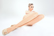 © matusciac - beautiful woman with long sexy legs wearing skin color stockings