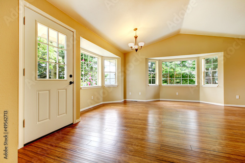 Fotografie, Obraz Large empty newly remodeled living room with wood floor.