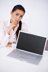 Wall Mural - Business woman sitting at her desk with laptop