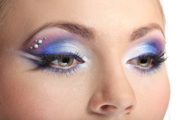 Beautiful female eyes with bright blue make-up