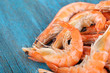 Shrimps on blue wooden table