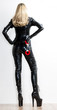 © Richard Semik - standing woman wearing extravagant clothes with handcuffs