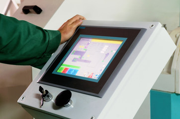 man operating factory machinery