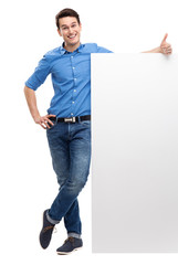 Wall Mural - Man with blank poster showing thumbs up