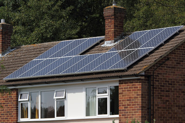 Solar photovoltaic panel array on house roof