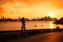 Young Woman Running At Sunset