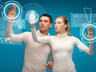 Wall Mural - man and woman working with virtual screens