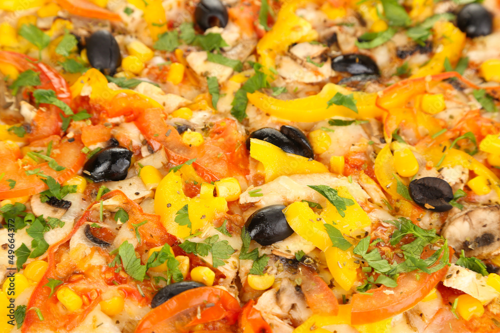 Tasty pizza with vegetables, chicken and olives close-up