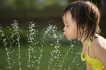 Child Drinking From The Water Fountain
