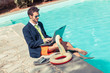 © william87 - Funny Young Businessman with SwimmingTrunks next to the Pool