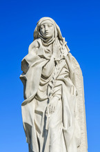 Saint Catherine Of Siena Against Sky Background