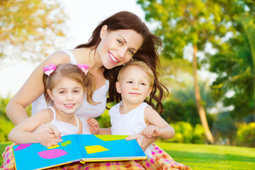 Wall Mural - Happy family reading book