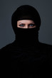 © volkonskaya - woman in burka over dark background